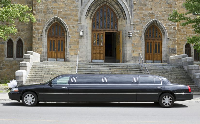 Luxury,Black,Limousine,Awaiting,In,Front,Of,A,Church